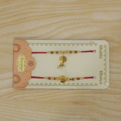 Couple Rakhi with Gold Coin Charm, Pearl Drop and Multicolor Bead Accents