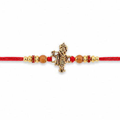 Krishna Flute Idol Devotional Rakhi with Golden Centre, Wooden Beads and Red Thread