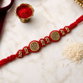 Red Braided Rakhi with a Row of Antique Gold Coin-Style Charms