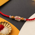 Red Thread Rakhi with Wooden and Sparkling Crystal Bead Pendant