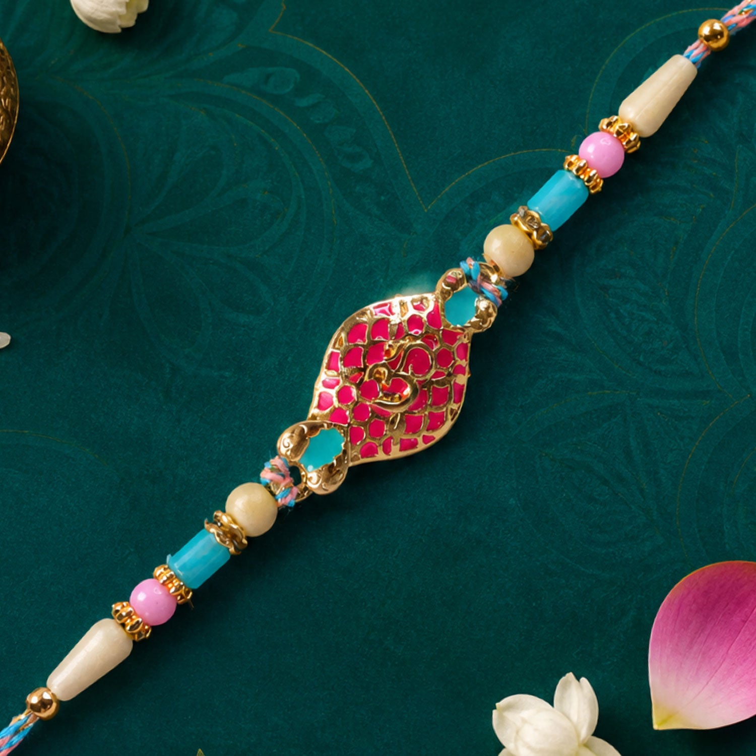 Festive Rakhi with Paisley Heart Charm, blue stones and wrist style for Gift Use