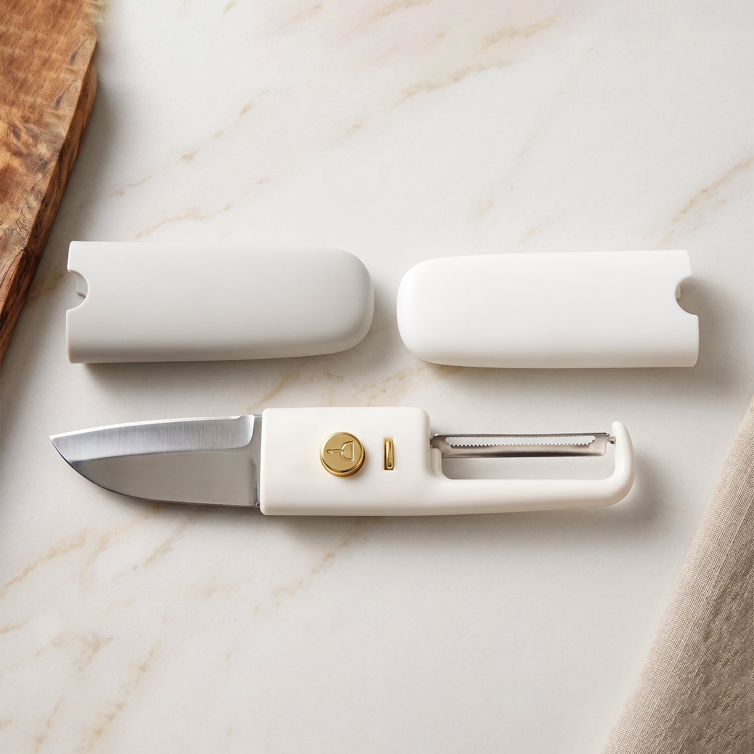 2-in-1 multifunctional knife and peeler tool on kitchen counter