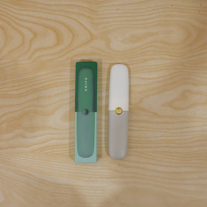 2-in-1 multifunctional knife and sawtooth peeler tool in use on kitchen counter