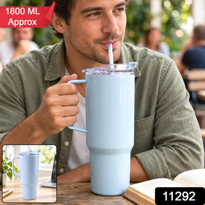 A man sips from a large light blue handled tumbler with a straw, with an inset showing the tumbler.