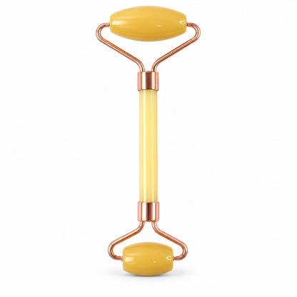 Dual-ended facial roller on white background
