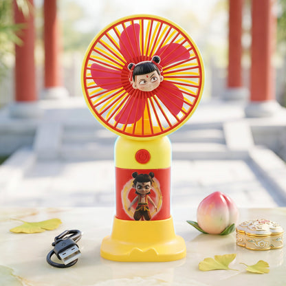 Mini handheld fan with charging cable and stand