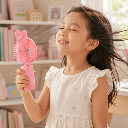 Handheld personal fan in use