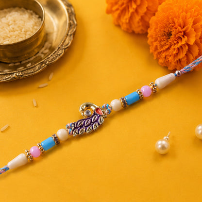 Blue Enamel Peacock Pendant Rakhi with Pastel Beads