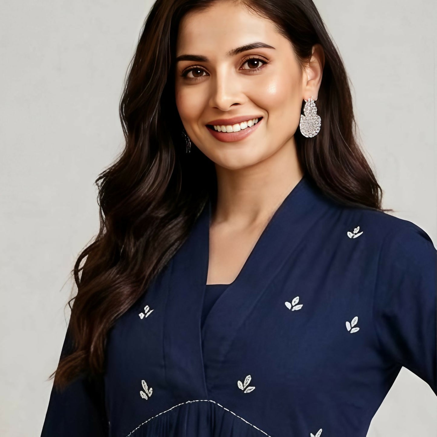 Close-up of deep blue cotton kurti with subtle floral embroidery detail