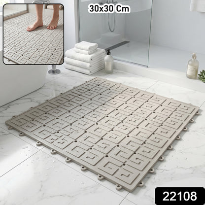 Close-up of textured non-slip shower floor mat with drainage holes