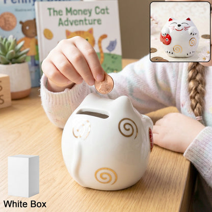 Cute ceramic cat piggy bank with glossy finish, perfect for saving coins.
