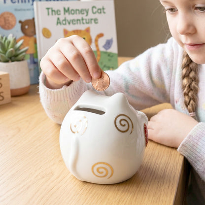 Close-up of the glossy finish on the ceramic cat piggy bank.