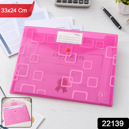 A closed pink plastic document folder with a button closure and a label, on a desk with papers.