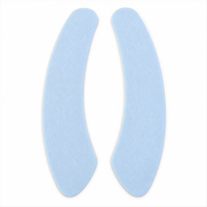 A pair of light blue, curved fabric pads are shown against a plain white background.