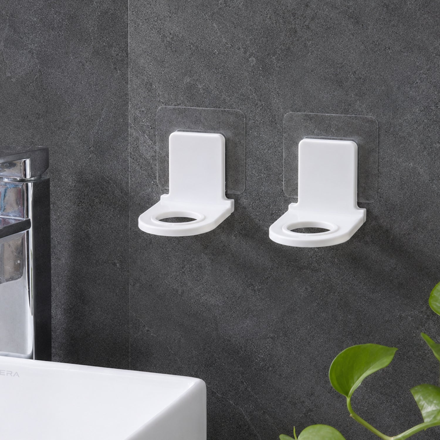 Self adhesive bottle holders mounted near sink