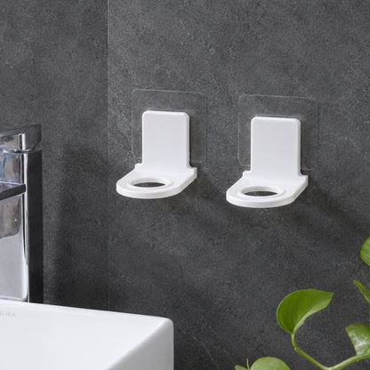 Self adhesive bottle holders mounted near sink