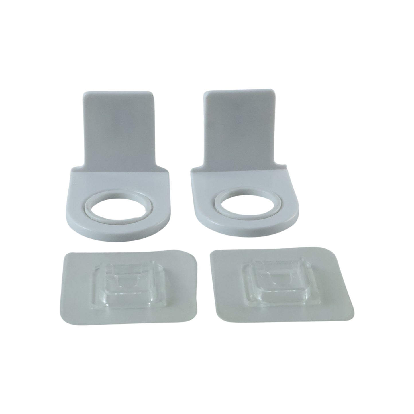 Plastic shampoo bottle holders on white background