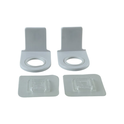 Plastic shampoo bottle holders on white background