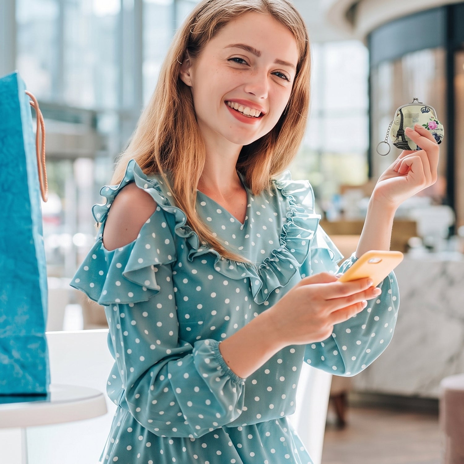 Mini coin purse keychain carried by woman