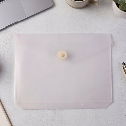 Transparent button closure document folder on office desk