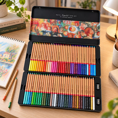 An open black metal tin with 72 colored pencils and sharpeners sits on a wooden desk with art books and a drawing.