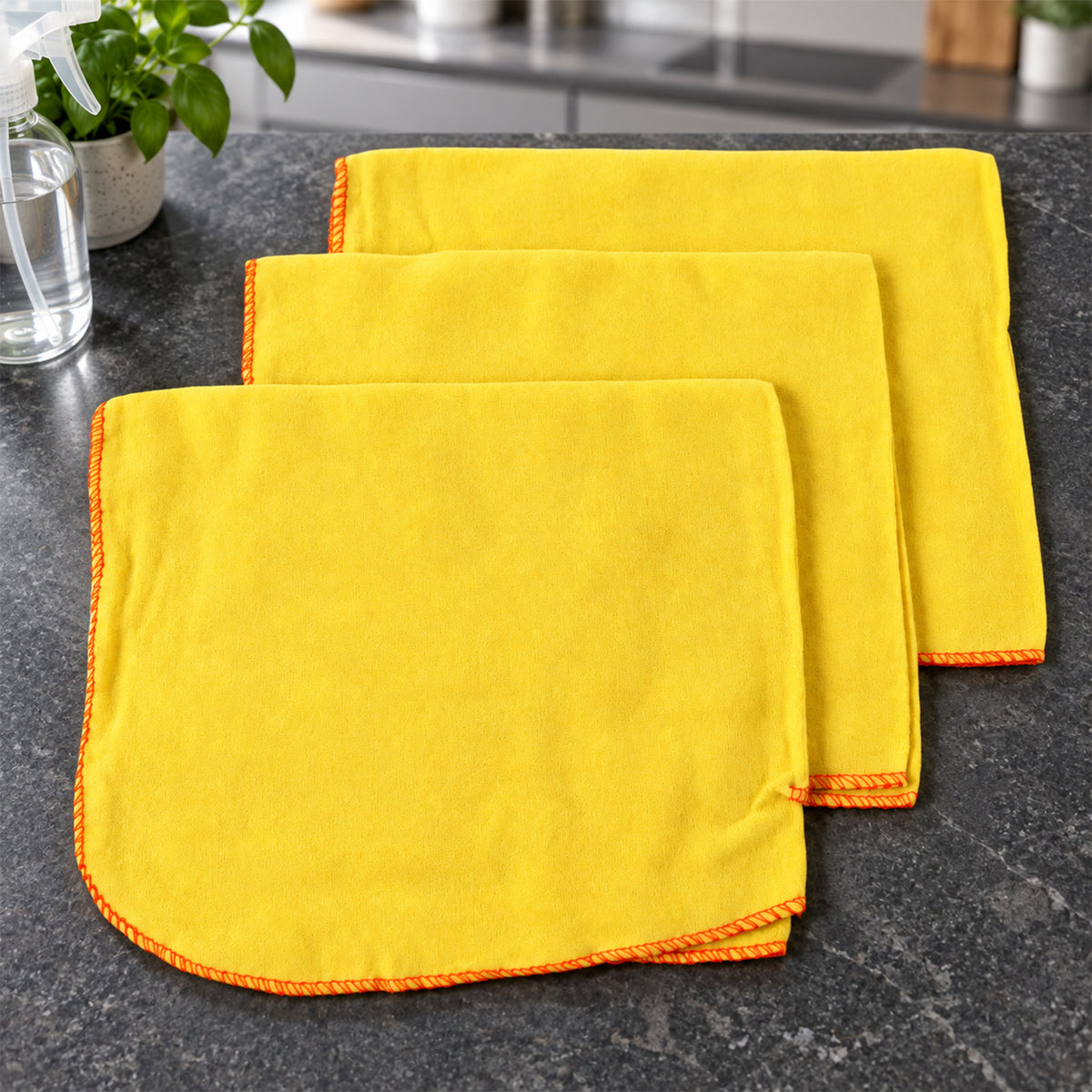 Three yellow cotton cleaning cloths
