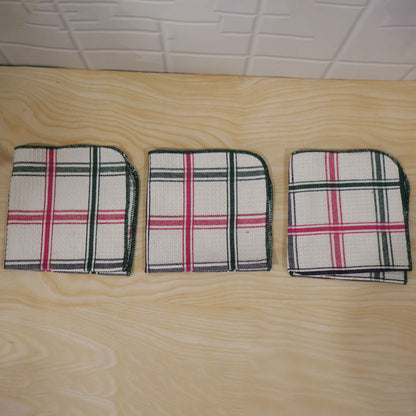 Actual photograph of three folded checked dish cloths