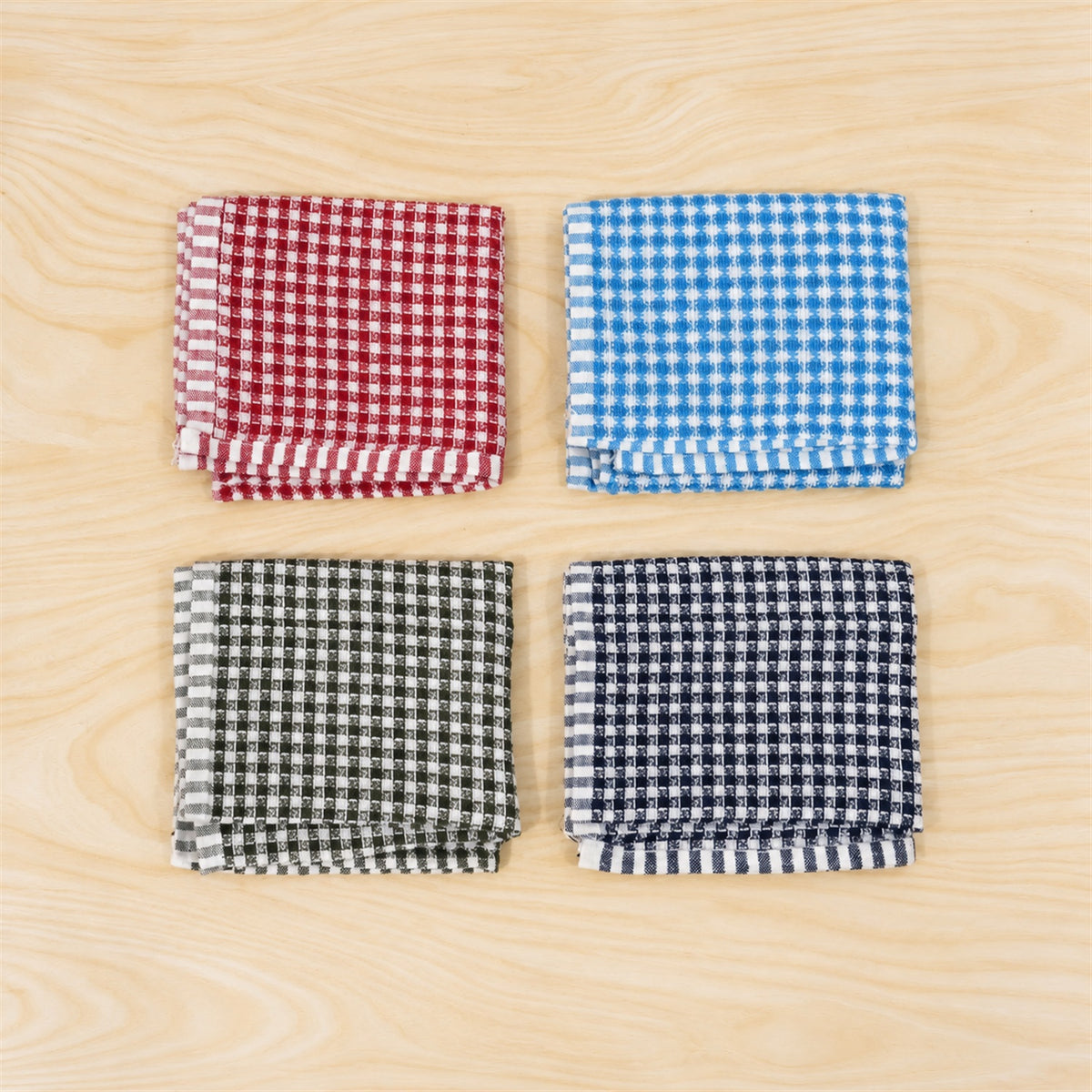 Actual photograph of four folded checked kitchen towels