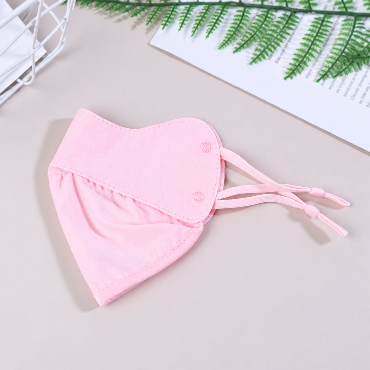 Soft fabric face cover showing its folded construction