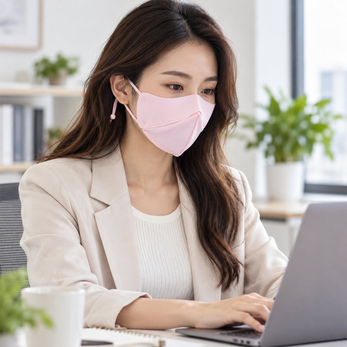 Face cover shown while seated at a desk