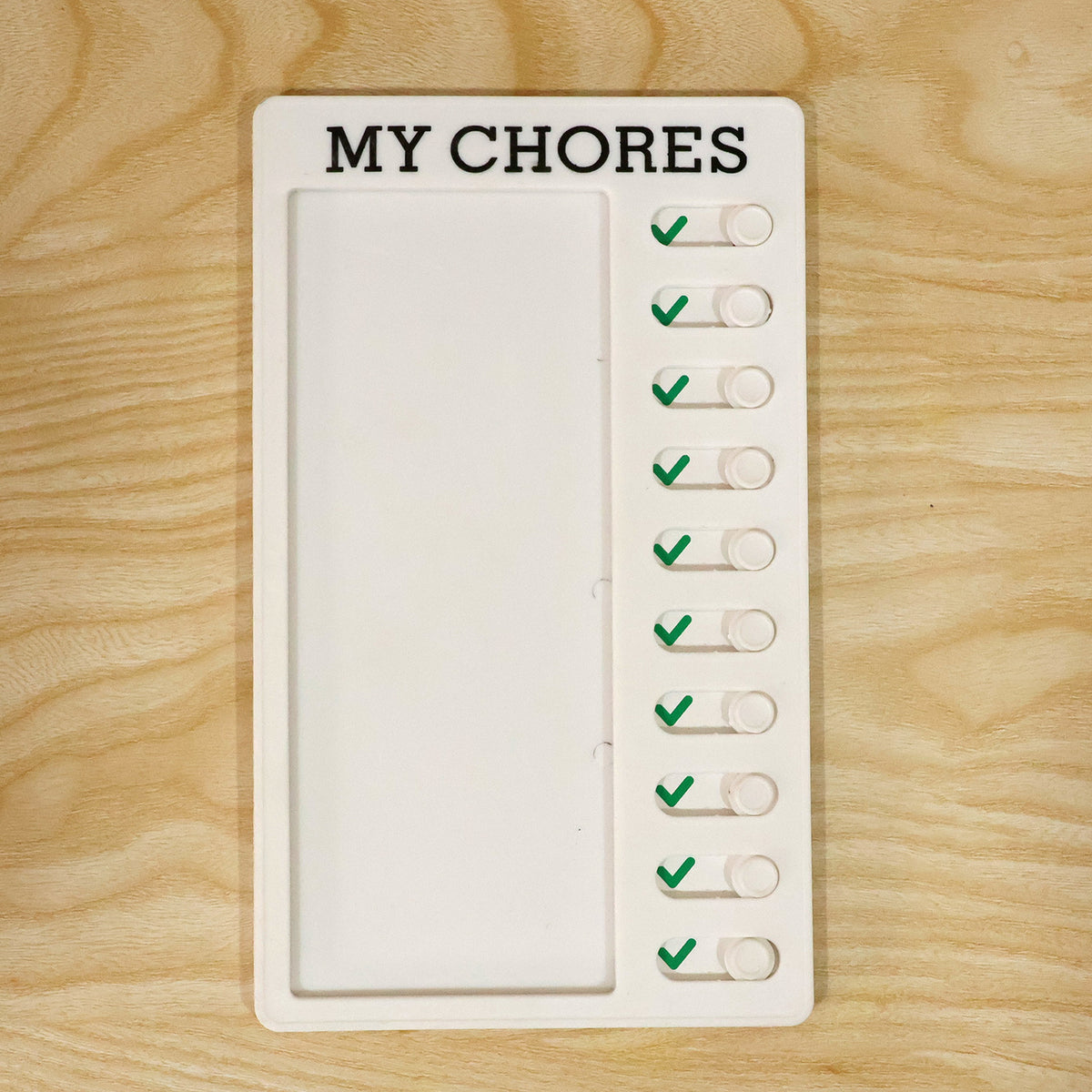 Actual photograph of My Chores sliding checklist board