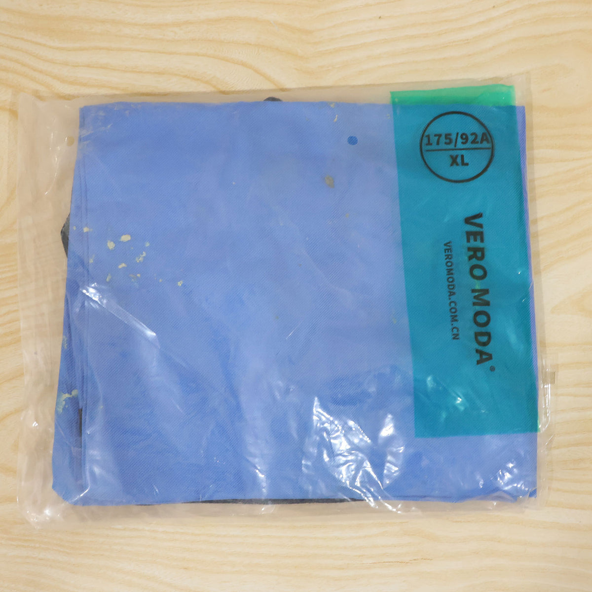 Actual photograph of folded carry bag in packaging