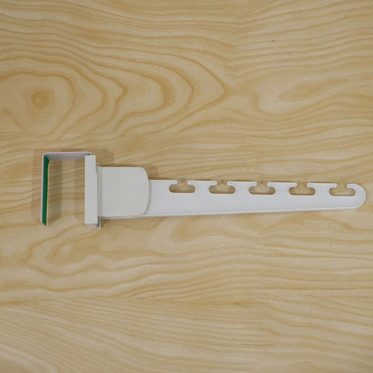 Actual photograph of plastic folding multi slot hanger
