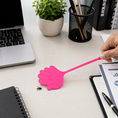 Hand shaped fly swatter in use