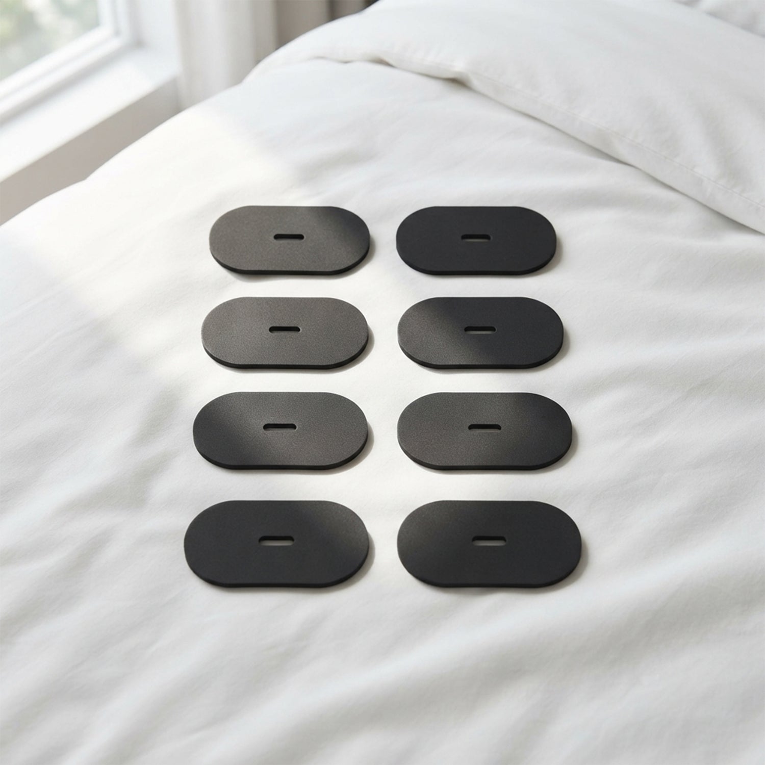 Black mouth tape patches arranged on bed