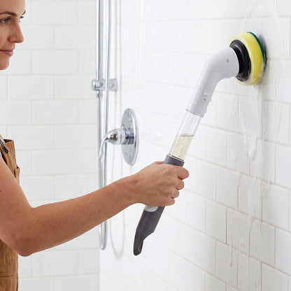 Cleaning brush scrubbing bathroom wall tiles