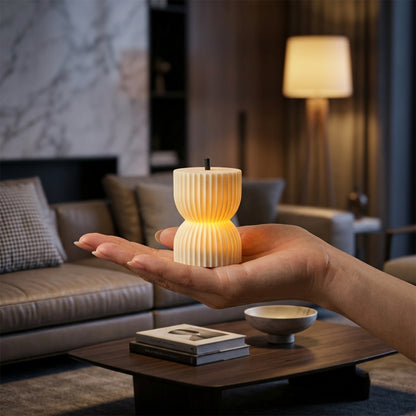 compact flameless LED candle in hand