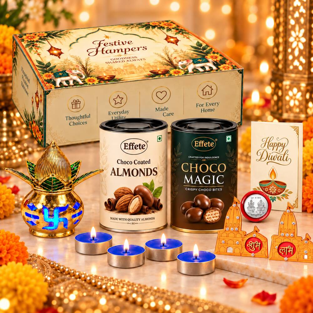 A collection of Diwali items including a decorative box, two chocolate tins, a golden kalash, four lit tealights, and a