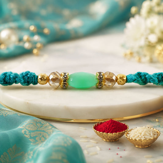 Close up of turquoise macrame rakhi featuring mint beads and delicate pearl accents.