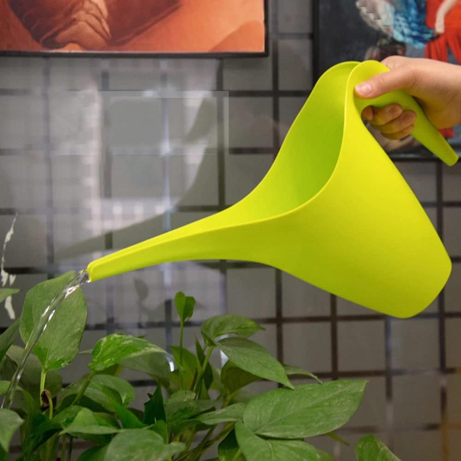 Plastic watering can pouring spout detail
