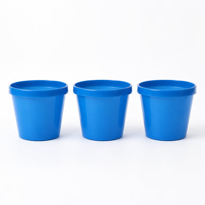 Round plastic planter pots on white background