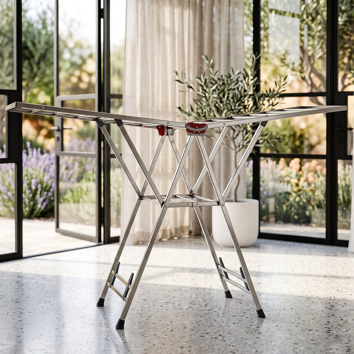 Foldable clothes drying rack on light background