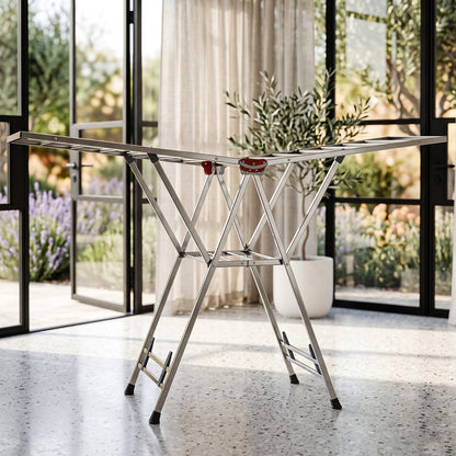 Foldable clothes drying rack on light background