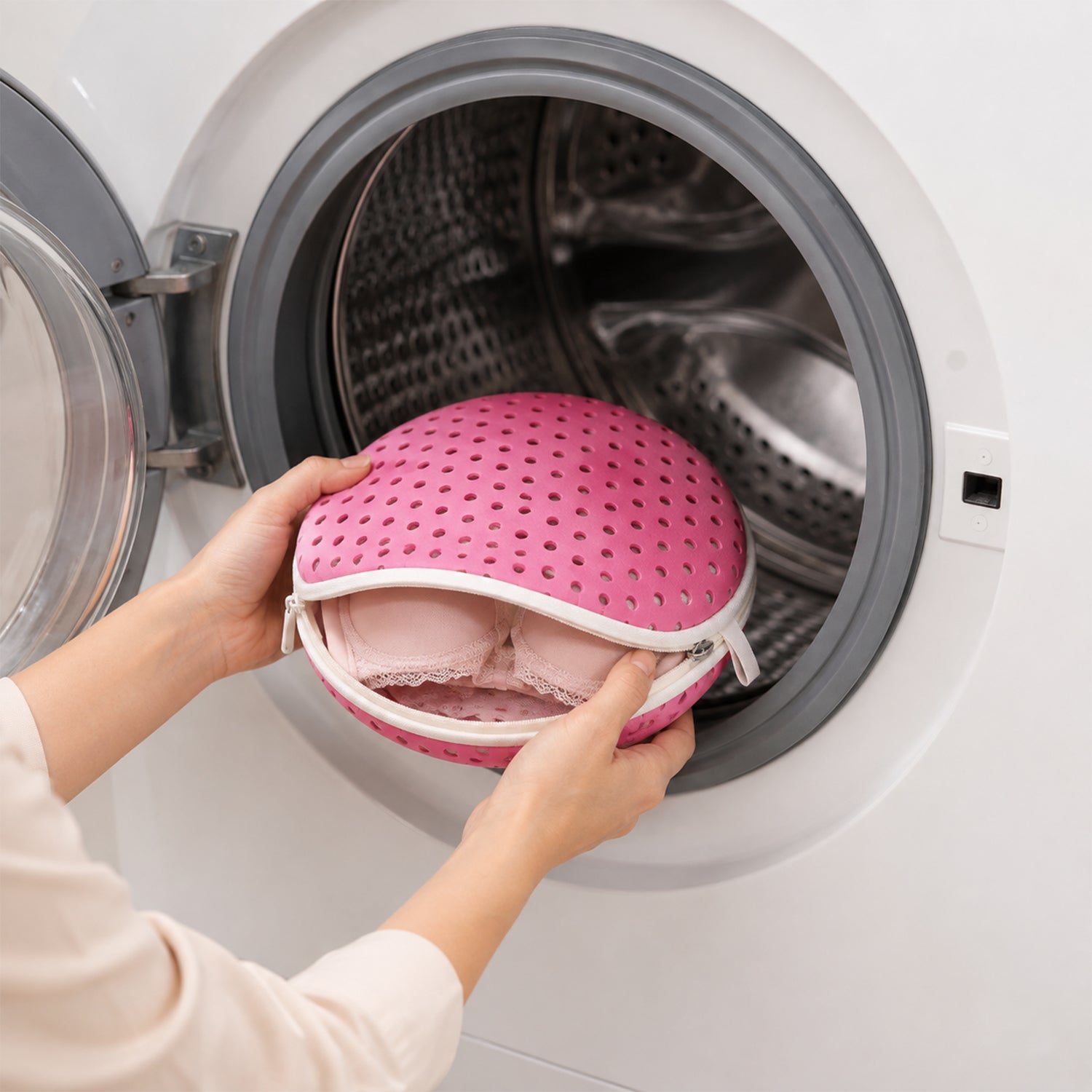 Bra wash bag being placed in washing machine
