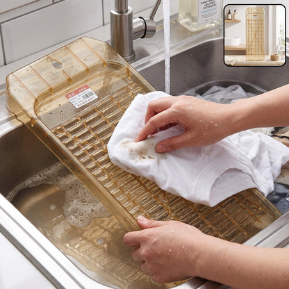 Portable plastic laundry washboard in use