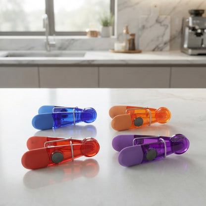 Colourful magnetic clips set on countertop