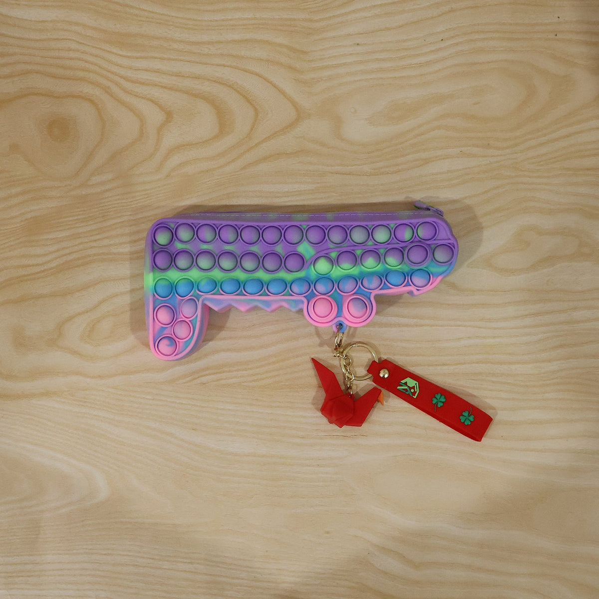 Multiple silicone pouches highlighting their flexibility and portable size.