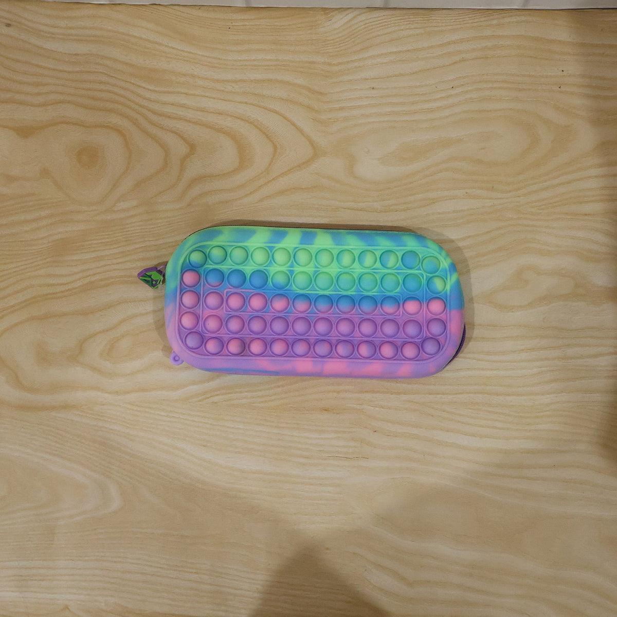 Detailed view of the vibrant pastel colors of the silicone pencil pouch