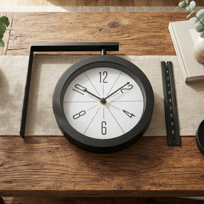 Modern round clock displayed on table