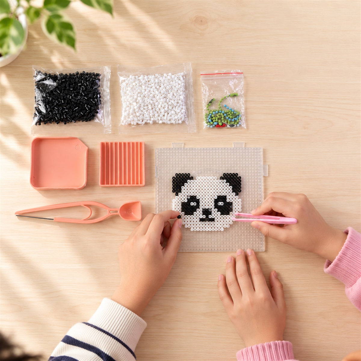 Kids plastic fuse beads craft kit used to make panda pixel art